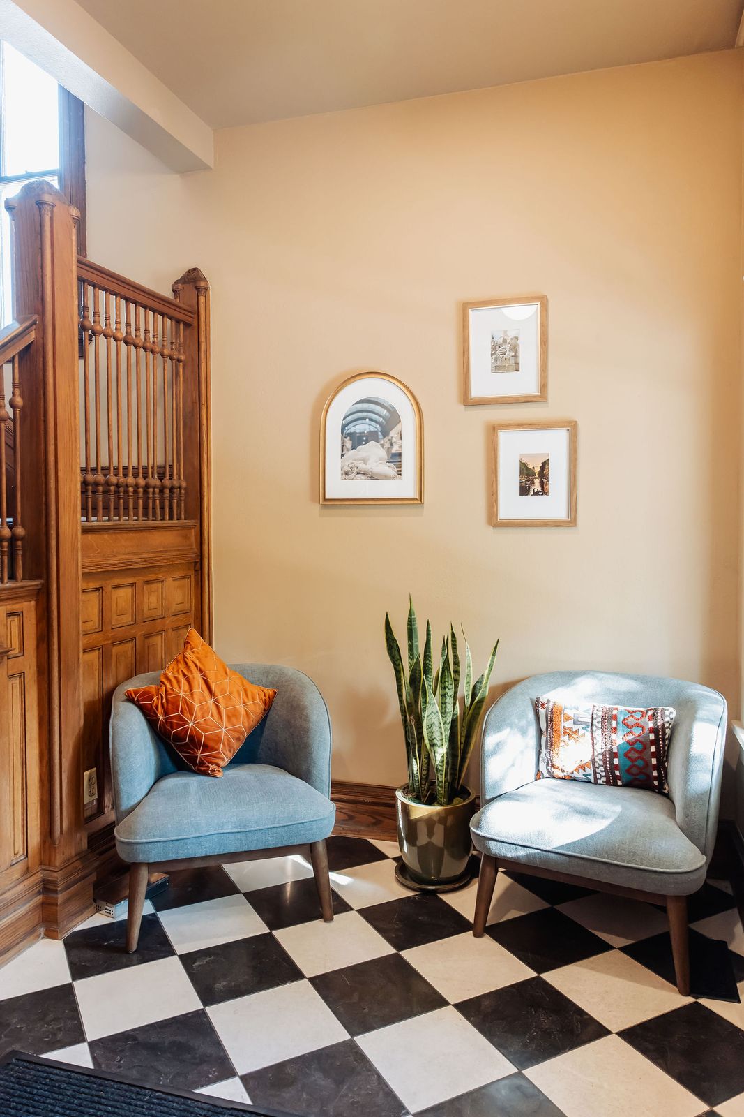 The waiting area at 1557 N Ogden Street, with blue armchairs and a checkered floor