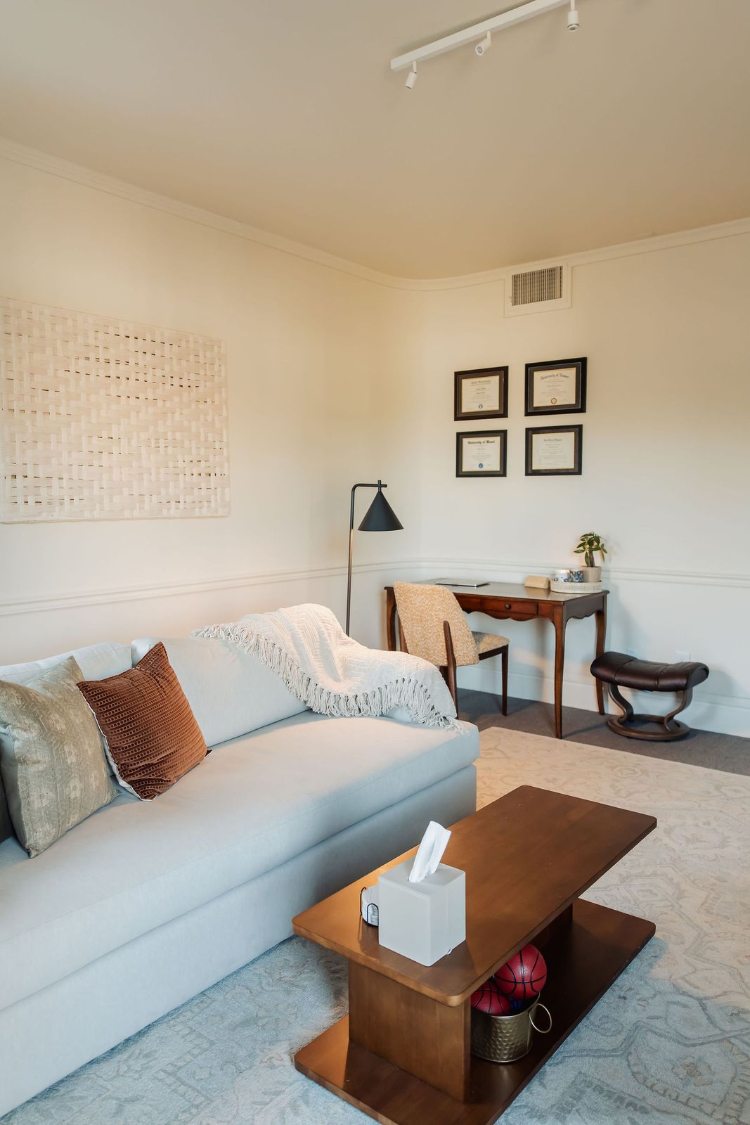 The sofa in Dr. Rosen's office, with a box of tissues on the coffee table